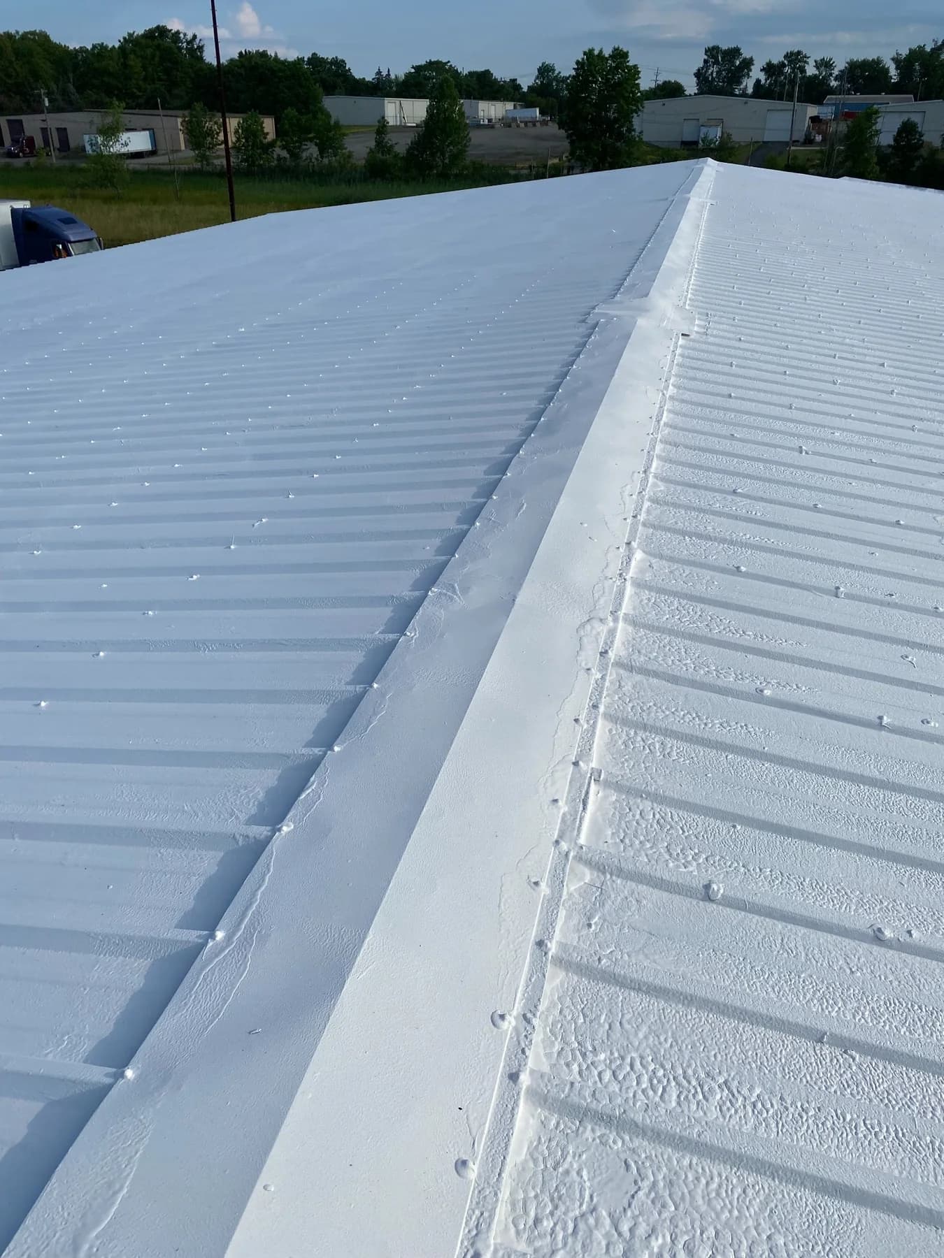 Commercial white roof coating detail